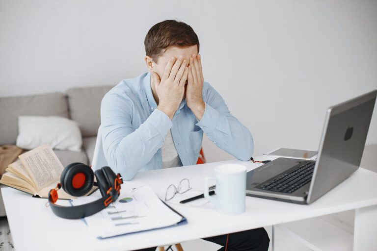 Frustrated Man Working in Home Office 